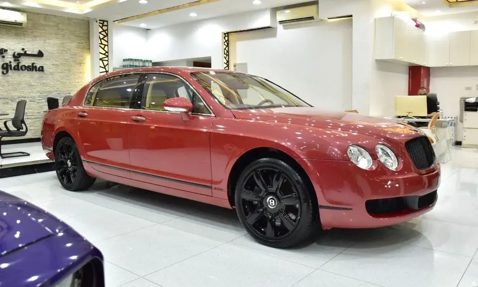Bentley Flying Spur EXCELLENT DEAL for our Bentley Flying Spur V12 ( 2007 Model ) in Orange Color GCC Specs